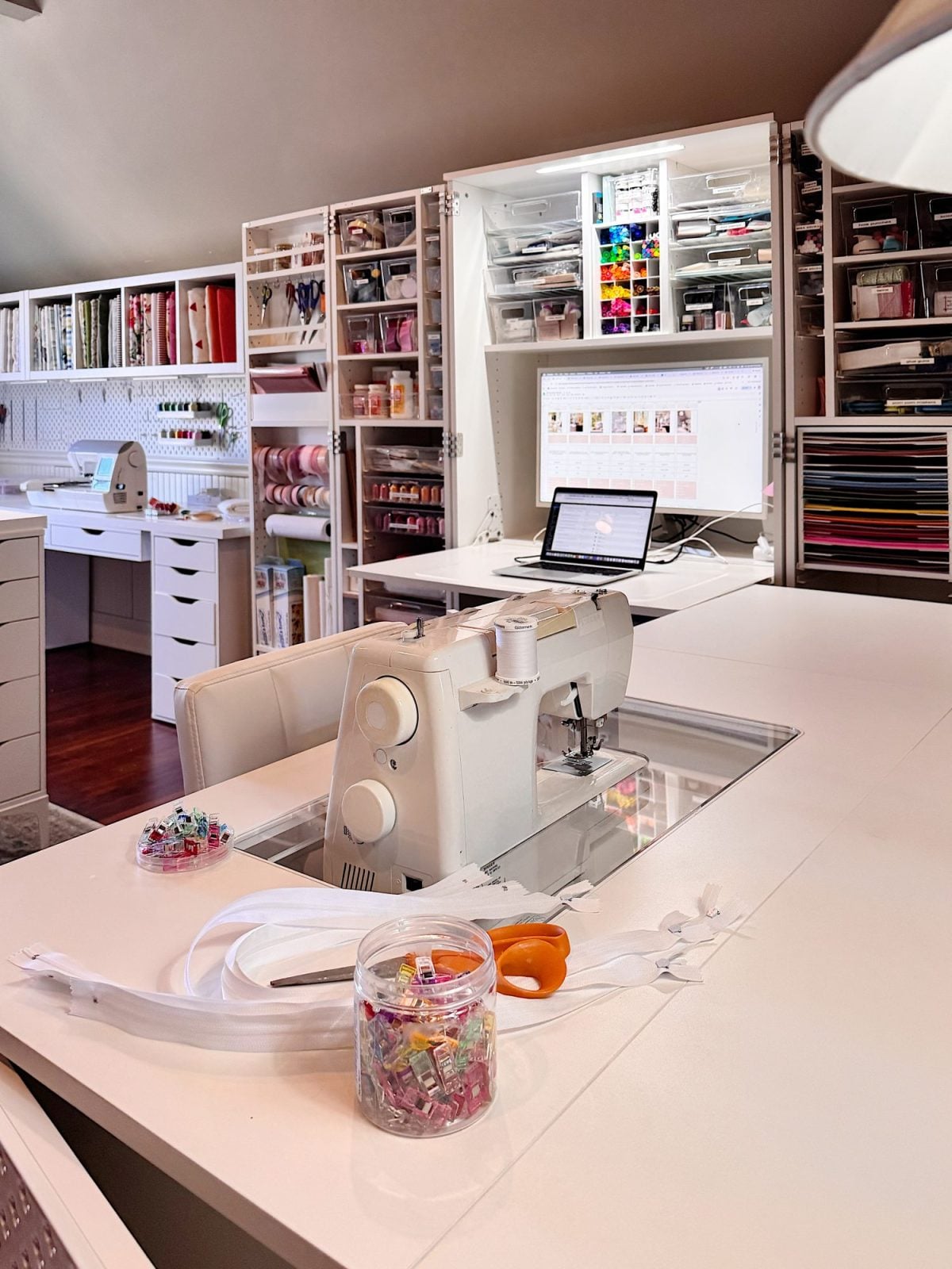 Premium embroidery workspace with thread spools and fabric
